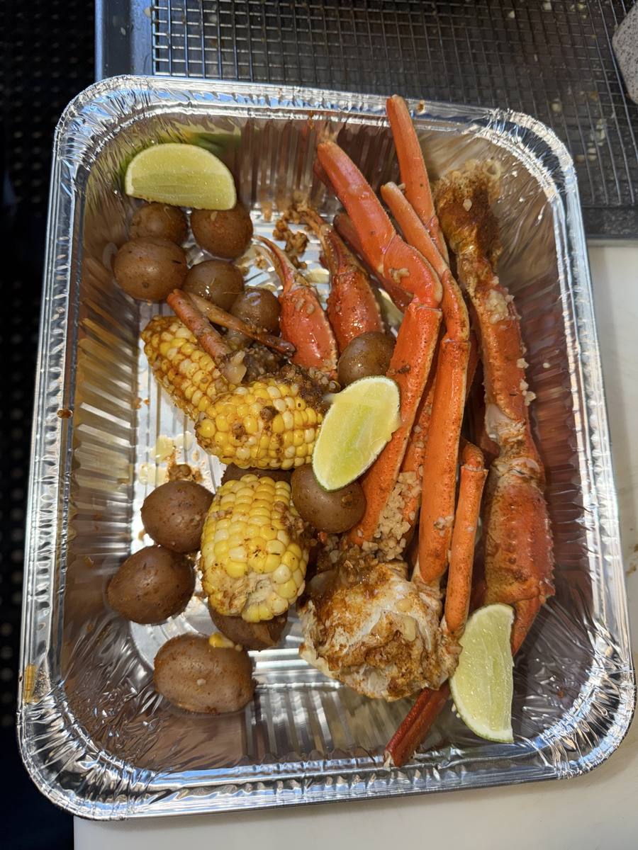 Crab legs, shrimp, potatoes and vegetables